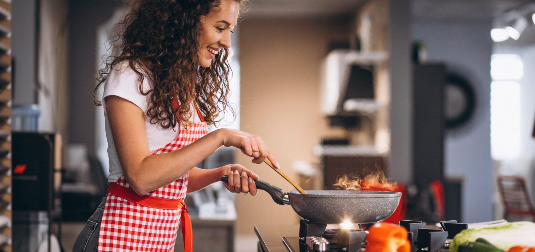 woman-chef-cooking-vegetables-pan (1)